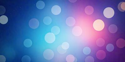 The primary subject of the image is a blue background with a pattern of white circles. The setting is a space with a purple hue, giving the scene a unique and artistic appearance. The visual style is a combination of digital art and illustration, creating a vibrant and eye-catching design. The dominant colors are blue and purple, with the white circles adding a contrasting element to the overall atmosphere.