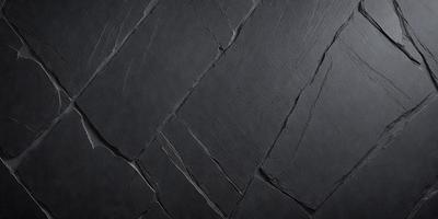 The primary subject of the image is a black stone wall. The setting is a dark room, and the visual style is a close-up of the stone wall. The colors and mood of the image are predominantly dark, with the black stone wall being the main focus.