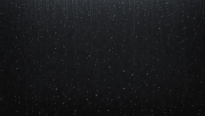 The primary subject of the image is a black background with a pattern of raindrops. The setting is a dark, rainy environment, and the visual style is a close-up of the raindrops on the black surface. The colors are predominantly black, and the overall atmosphere is moody and atmospheric.