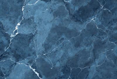 The primary subject of the image is a blue marble wall with a pattern of white and black swirls. The setting is a room with a blue marble floor, and the visual style is a close-up of the marble wall. The colors and mood of the image are predominantly blue and black, creating a calm and sophisticated atmosphere.