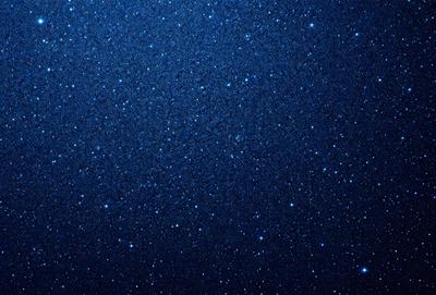 The primary subject of the image is the night sky, which is filled with stars. The setting is a dark, star-filled background, creating a sense of depth and space. The visual style is a photo of the night sky, capturing the beauty of the stars and the vastness of the universe. The colors and mood of the image are predominantly dark and serene, with the stars providing a sense of wonder and tranquility.