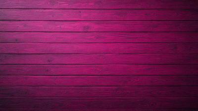 The primary subject of the image is a wooden wall with a pinkish hue. The setting is a room with a wooden floor, and the visual style appears to be a photo. The dominant colors in the image are pink and brown, creating a warm and inviting atmosphere.