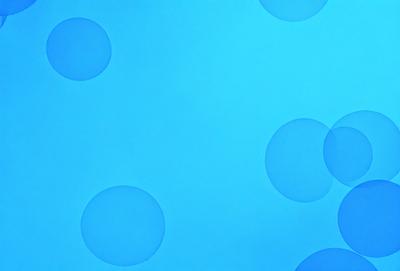 The primary subject of the image is a blue background with a pattern of white circles. The setting is a blue sky, and the visual style is a digital art or illustration. The dominant colors are blue and white, creating a calm and serene atmosphere.