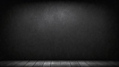 The primary subject of the image is a black wall with a wooden floor. The setting is a room with a black background, and the visual style is a photo. The colors and mood of the image are dark and moody, with the black wall and wooden floor creating a sense of depth and contrast.
