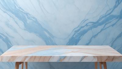 The primary subject of the image is a wooden table with a marble top. The table is situated in front of a blue and white marble wall, which serves as the setting and background of the scene. The visual style of the image is a photo, capturing the natural beauty of the marble and the wooden table. The colors and mood of the image are predominantly blue and white, creating a serene and elegant atmosphere.