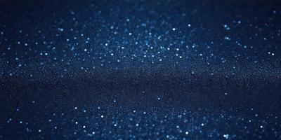 The primary subject of the image is a blue background with a pattern of bright, shiny, and sparkling lights. The setting appears to be a dark, starry night, with the lights creating a mesmerizing effect. The visual style of the image is a combination of a photo and digital art, as it captures the beauty of the night sky with the sparkling lights. The colors and mood of the image are predominantly blue, with the bright lights adding a sense of warmth and excitement to the scene.