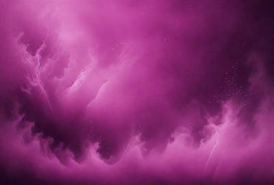 The primary subject of the image is a purple sky with a pinkish hue. The setting is a cloudy sky, and the visual style appears to be a digital art or illustration. The dominant colors in the image are purple and pink, creating a serene and calming atmosphere.