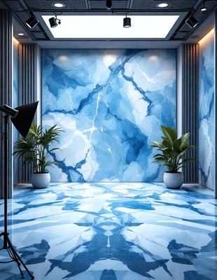 The primary subject of the image is a large blue and white marble wall. The setting is a room with a blue and white marble floor, and the visual style is a photo. The colors and mood of the image are predominantly blue and white, creating a clean and elegant atmosphere.