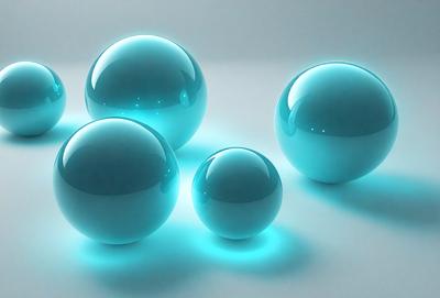 The primary subject of the image is a group of four blue glass balls. They are placed on a white surface, which serves as the setting and background. The visual style of the image is a photo, capturing the vibrant colors and the smooth, reflective surfaces of the glass balls. The overall atmosphere of the image is calm and serene, with the blue glass balls creating a sense of harmony and balance.