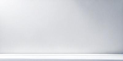 The primary subject of the image is a white wall. The setting is a room with a white wall, and the visual style is a photo. The colors and mood of the image are predominantly white, creating a clean and minimalist atmosphere.