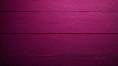 The primary subject of the image is a purple wall. The setting is a room with a purple wall, and the visual style is a close-up of the wall. The colors and mood of the image are predominantly purple, creating a calm and serene atmosphere.