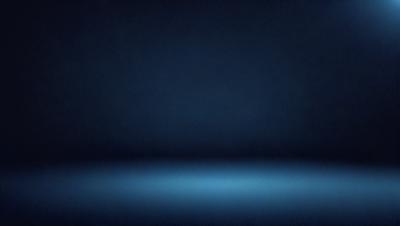 The primary subject of the image is a blue background. The setting is a dark room, and the visual style is a photo. The dominant colors are blue and black, creating a calm and serene atmosphere.