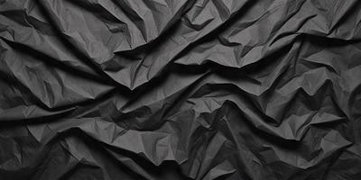 The primary subject of the image is a black and white paper, which is the main object, scene, or focus of the image. The setting is a black background, and the visual style is a photo. The colors and mood of the image are predominantly black and white, giving it a classic and timeless appearance.