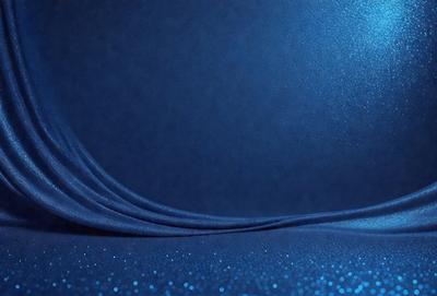The primary subject of the image is a blue cloth, which is the main object, scene, or focus of the image. The setting or background is a blue surface, which adds to the overall atmosphere. The visual style of the image is a photo, as it captures the blue cloth in detail. The colors and mood of the image are predominantly blue, creating a calm and serene atmosphere.