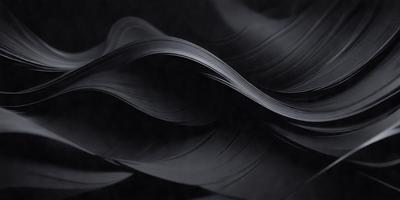The primary subject of the image is a black and white photograph of a wave. The setting is a dark background, which contrasts with the wave's shape and texture. The visual style is a close-up of the wave, showcasing its intricate details. The colors and mood of the image are predominantly dark, with the wave's shape and texture being the main focus.