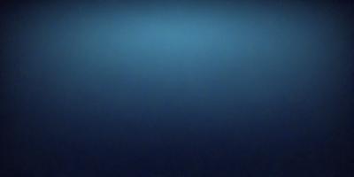 The primary subject of the image is a large body of water, which appears to be a deep blue ocean. The setting is a vast expanse of water, with no visible land or other objects in the background. The visual style of the image is a close-up of the water, showcasing its depth and color. The colors and mood of the image are predominantly dark and moody, with the deep blue water creating a sense of vastness and tranquility.