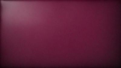 The primary subject of the image is a large, purple wall. The setting is a room with a red wall, and the visual style is a close-up of the wall. The dominant colors are purple and red, creating a bold and striking atmosphere.