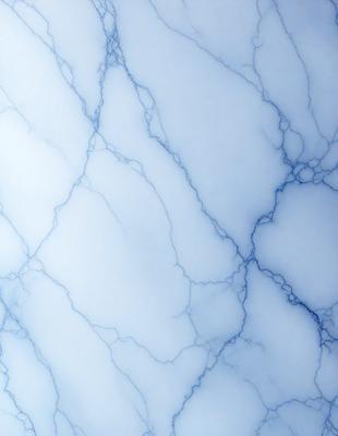 The primary subject of the image is a close-up of a marble-like surface, possibly a wall or a countertop. The setting is a room with a blue-gray color scheme, which gives the space a modern and sophisticated appearance. The visual style is a close-up of the marble-like surface, showcasing its intricate patterns and textures. The colors and mood of the image are predominantly blue and gray, creating a calm and elegant atmosphere.