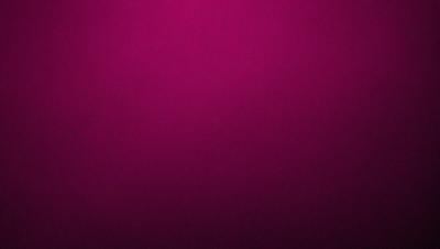 The primary subject of the image is a large, purple wall. The setting is a room with a pink background. The visual style is a close-up of the purple wall, which gives a sense of depth and texture. The dominant colors are purple and pink, creating a warm and inviting atmosphere.