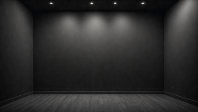The primary subject of the image is a black wall with a light shining on it. The setting is a dark room, and the visual style is a black and white photo. The dominant colors are black and white, and the overall atmosphere is moody and dramatic.