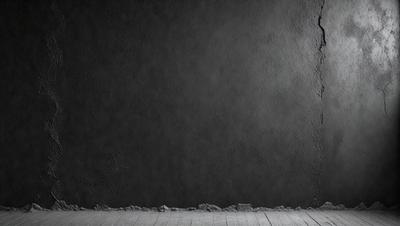 The primary subject of the image is a black wall with a grey texture. The setting is a room with a wooden floor. The visual style is a black and white photo. The dominant colors are black and grey, creating a moody atmosphere.