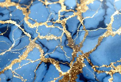 The primary subject of the image is a blue marble surface with gold glitter or gold paint on it. The setting is a blue marble countertop, and the visual style appears to be a combination of a photo and digital art or illustration. The colors and mood of the image are predominantly blue and gold, creating a luxurious and elegant atmosphere.
