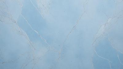The primary subject of the image is a blue sky with white clouds. The setting is a cloudy sky, and the visual style is a photo. The colors and mood of the image are predominantly blue and calm, creating a serene atmosphere.