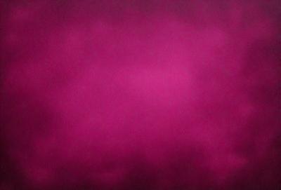 The primary subject of the image is a pink cloudy sky. The setting is a cloudy sky, and the visual style is a photo. The dominant colors are pink and purple, creating a warm and atmospheric mood.