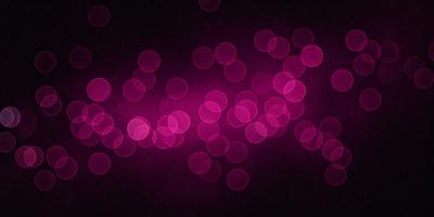 The primary subject of the image is a purple background with a pattern of pink dots. The setting is a dark background, which contrasts with the bright pink dots. The visual style is a digital art or illustration, as the dots are arranged in a visually appealing manner. The colors and mood of the image are predominantly pink and purple, creating a warm and inviting atmosphere.