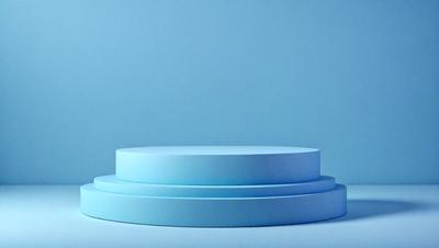 The primary subject of the image is a blue cake, which is placed on a blue surface. The setting appears to be a studio or a controlled environment, as the cake is displayed on a table. The visual style of the image is a close-up, which emphasizes the cake's details. The colors and mood of the image are predominantly blue, creating a calm and serene atmosphere.