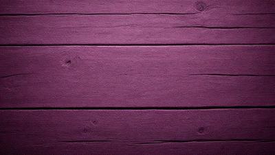 Purple wall with a wooden texture.