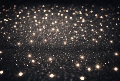 The primary subject of the image is a close-up of a shiny, reflective surface, possibly a black background or a shiny fabric. The setting appears to be a dark room, with the light source coming from the shiny surface. The visual style of the image is a close-up of a pattern, which creates a sense of depth and intricacy. The colors in the image are predominantly black and white, with the shiny surface reflecting light and creating a contrasting effect. The overall atmosphere of the image