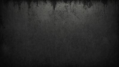 The primary subject of the image is a black and white photo of a wall. The setting is a concrete wall, and the visual style is a black and white photo. The colors and mood of the image are predominantly dark and moody, with the black and white color scheme adding to the atmosphere.