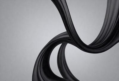 The primary subject of the image is a pair of black, curved lines. The setting is a gray background, which provides a neutral and clean environment for the lines. The visual style is a combination of digital art and illustration, as the lines are drawn with precision and detail. The colors and mood of the image are predominantly black, giving it a sleek and modern appearance.