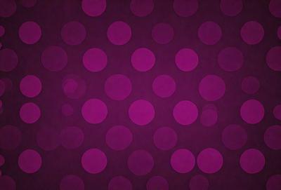 The primary subject of the image is a pattern of purple circles on a purple background. The setting is a close-up of the pattern, showcasing the intricate design of the circles. The visual style is a digital art or illustration, as the circles are perfectly round and the background is a solid color. The dominant colors are purple, creating a calm and soothing atmosphere.