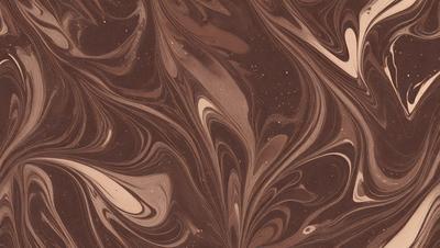 The primary subject of the image is a close-up of a brown and white swirling pattern, which appears to be a chocolate-colored swirl. The setting is a surface with a swirling pattern, possibly a wall or a piece of art. The visual style is a close-up of the swirling pattern, which gives a sense of depth and intricacy to the design. The colors and mood of the image are predominantly brown and white, creating a warm and inviting atmosphere.