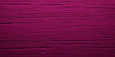 The primary subject of the image is a close-up of a purple wall with a patterned texture. The setting is a room with a pink wall, and the visual style appears to be a photo. The dominant colors in the image are purple and pink, creating a warm and inviting atmosphere.