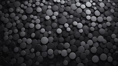 The primary subject of the image is a close-up of a black and white pattern of circles. The setting is a black background, which creates a striking contrast with the circles. The visual style is a combination of a photo and a digital art, as the circles appear to be a part of a larger pattern. The dominant colors are black and white, and the overall atmosphere is one of simplicity and elegance.