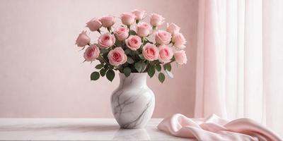 The primary subject of the image is a vase filled with pink roses. The vase is placed on a table, and the roses are arranged in a bouquet. The setting is a room with a pink background, which adds a warm and inviting atmosphere to the scene. The visual style of the image is a close-up of the vase and roses, showcasing the details of the flowers and the vase. The colors and mood of the image are predominantly pink, creating a sense