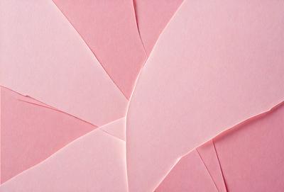 The primary subject of the image is a piece of pink paper with a cutout in the shape of a heart. The paper is placed on a pink background, giving the scene a warm and romantic atmosphere. The visual style of the image is a close-up of the paper, showcasing the cutout and the surrounding pink paper. The colors and mood of the image are predominantly pink, creating a sense of love and affection.