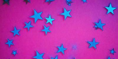 The primary subject of the image is a collection of blue stars. The setting is a pink background, which creates a contrasting and visually appealing effect. The visual style is a combination of digital art and illustration, as the stars are arranged in a pattern. The colors and mood of the image are predominantly pink and blue, giving it a warm and inviting atmosphere.