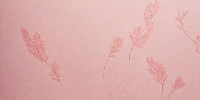 The primary subject of the image is a pink background with a pattern of leaves. The leaves are drawn in a way that gives the impression of a pink paper with leaves on it. The setting is a pink paper, and the visual style is a combination of drawing and pattern. The colors and mood of the image are predominantly pink, creating a warm and inviting atmosphere.