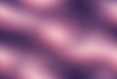 The primary subject of the image is a purple and pink swirling pattern, which creates a visually striking and artistic scene. The setting is a dark, purple background that contrasts with the swirling pattern, adding depth and interest to the composition. The visual style of the image is a combination of digital art and illustration, as it appears to be a digital creation rather than a photograph. The colors and mood of the image are predominantly purple and pink, giving it a warm and inviting