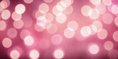The primary subject of the image is a pink background with a pattern of white lights. The setting is a pink background with a pattern of white lights. The visual style is a photo. The colors and mood are predominantly pink and bright, creating a warm and inviting atmosphere.