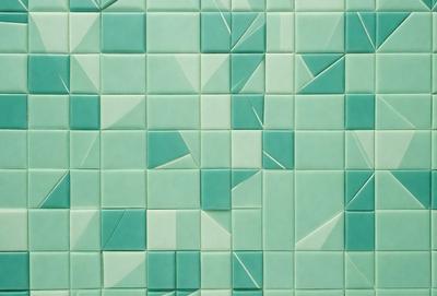 The primary subject of the image is a green tile wall with a pattern of triangles. The setting is a room with a green background, and the visual style is a close-up of the tile wall. The dominant colors are green and white, creating a calm and soothing atmosphere.