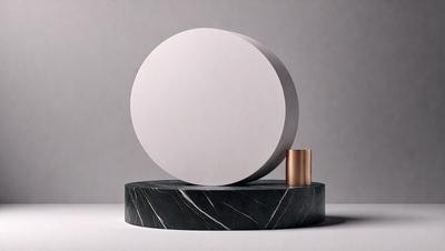 The primary subject of the image is a large, white, circular object, which appears to be a light fixture or a sculpture. The setting is a gray background, which provides a neutral and clean environment for the object. The visual style of the image is a close-up, which emphasizes the details of the circular object. The colors and mood of the image are predominantly neutral, with the white circular object being the main focus.