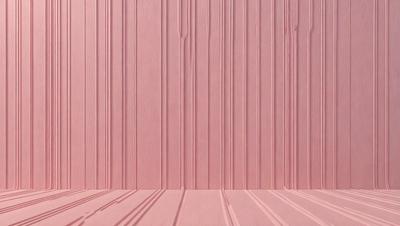 The primary subject of the image is a pink wall with a wooden texture. The setting is a room with a wooden floor. The visual style is a photo of a wooden wall with a pink hue. The colors and mood of the image are predominantly pink, creating a warm and inviting atmosphere.