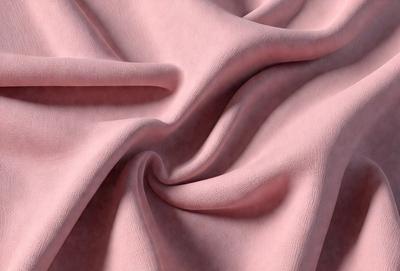 The primary subject of the image is a piece of pink fabric. The setting is a room with a pink background, and the visual style is a close-up of the fabric. The colors and mood of the image are predominantly pink, creating a warm and inviting atmosphere.