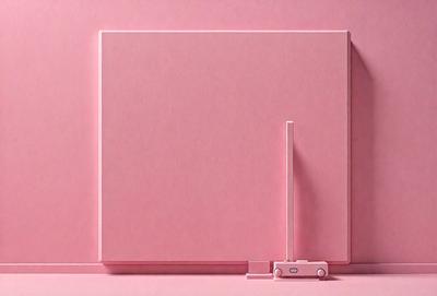 The primary subject of the image is a pink wall with a picture frame attached to it. The setting is a room with a pink background. The visual style is a photo, and the colors and mood are predominantly pink, creating a warm and inviting atmosphere.