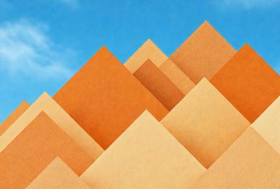 The primary subject of the image is a large stack of brown paper, which is the main object in the scene. The setting is a blue sky, providing a contrasting backdrop to the paper. The visual style of the image is a combination of photo and digital art, creating a unique and eye-catching representation of the paper. The colors and mood of the image are predominantly brown and orange, giving it a warm and earthy feel.
